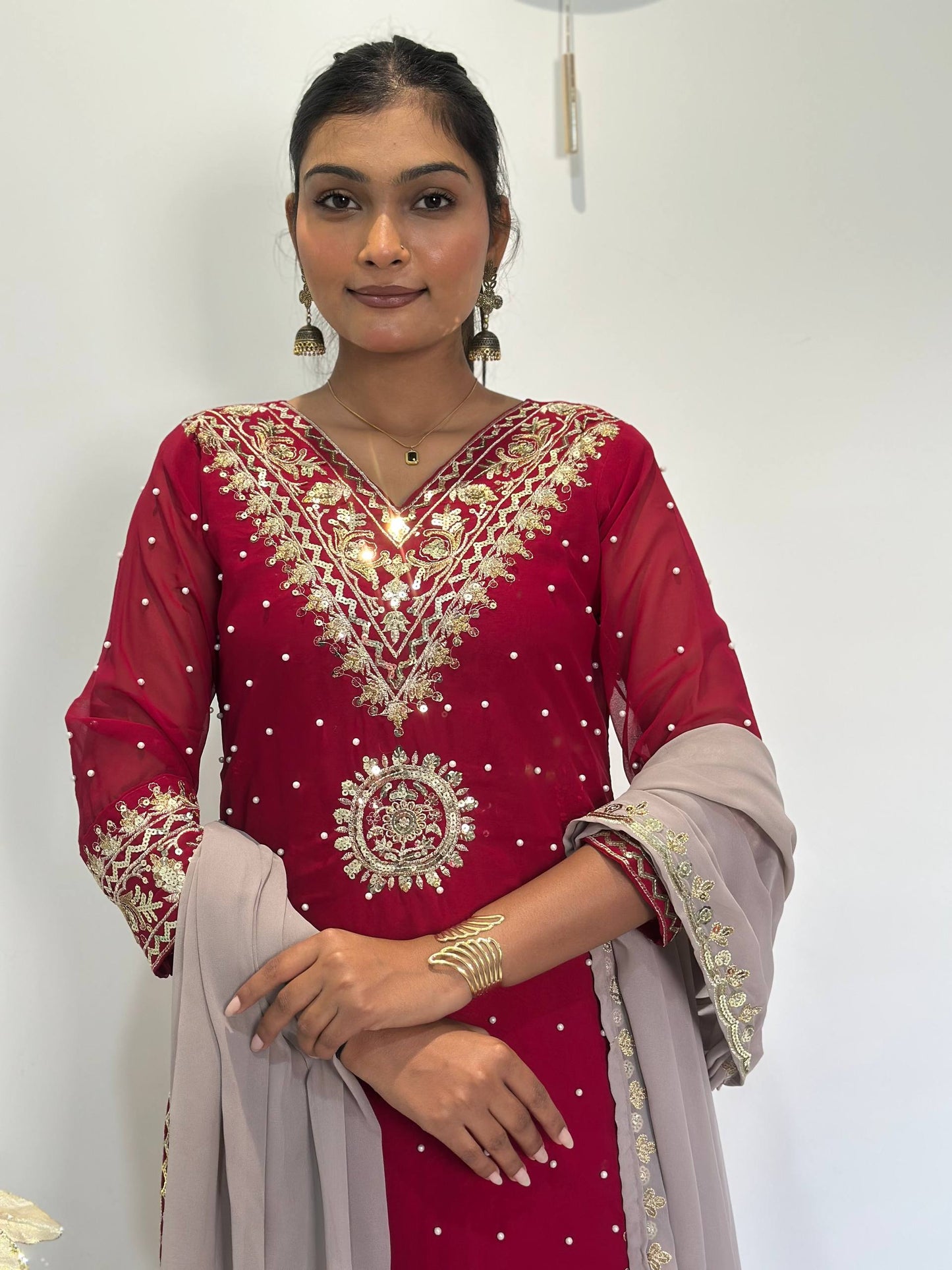 Opulent Faux Georgette Top-Plazzo Set Accented with Moti and Sequin Handwork